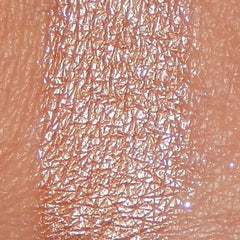 Side view of Mineral Eyeshadow in Creme Brulee showing pressed powder texture and warm caramel hue in compact case
