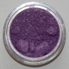 Close-up of soft lavender mineral eyeshadow with subtle shimmer in compact case