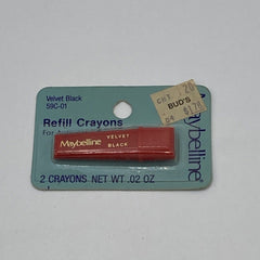 Side view of Maybelline black eye shadow crayon showing velvety matte texture and twist-up packaging