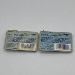 Close-up of matte black eye shadow crayon tip with smooth velvety texture in sleek silver packaging