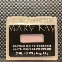 Side view of shimmering dusty lilac mineral eye shadow in compact, showcasing its iridescent finish and fine powder texture