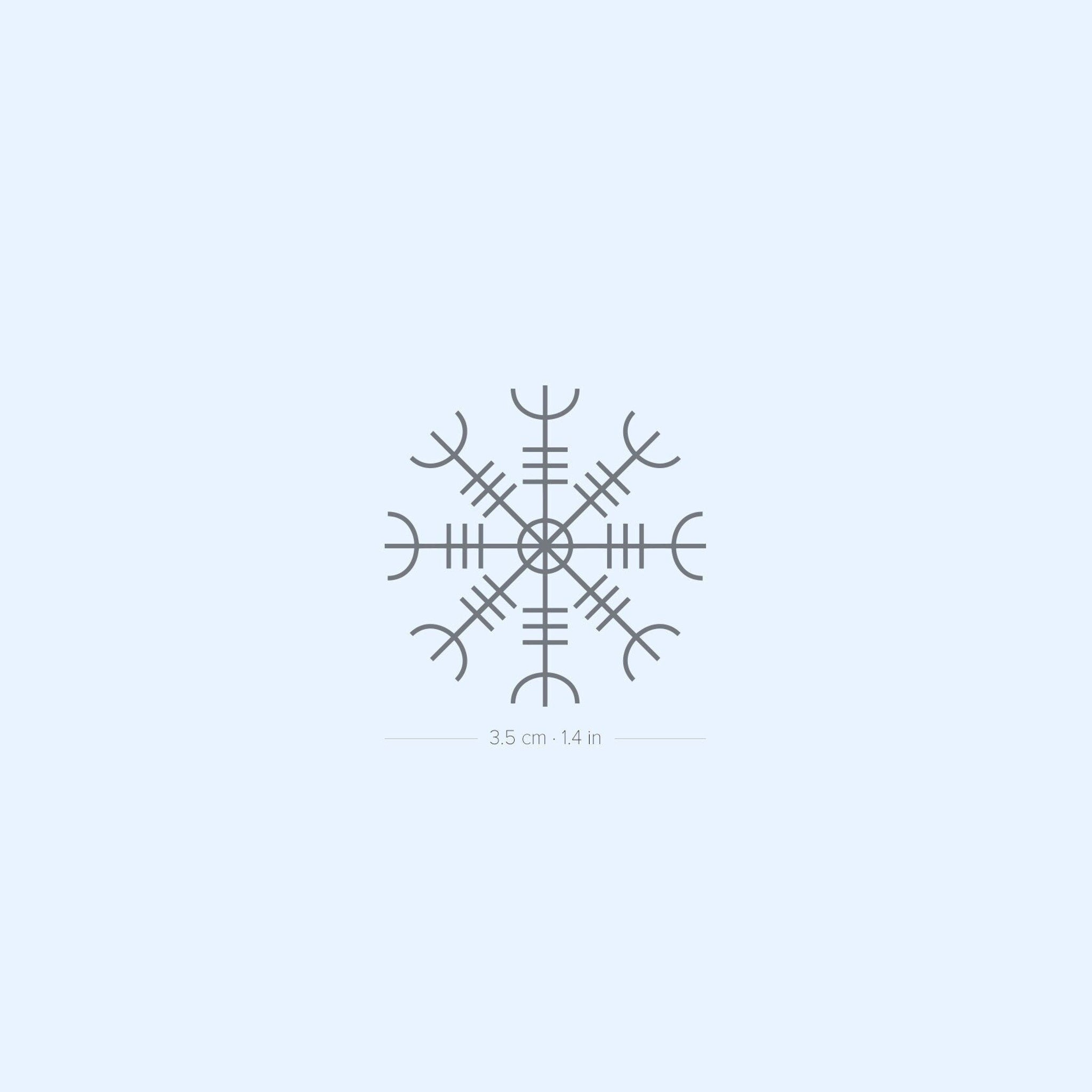 Two sleek black temporary tattoo sheets with intricate Norse rune designs, resting on a clean white surface.