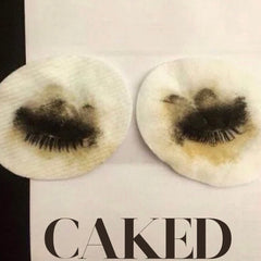 Makeup remover pads with white cotton, black residue, and text "CAKED" at the bottom