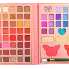 Close-up of 74 vibrant eyeshadow shades in matte, shimmer, and metallic finishes arranged in rectangular palette