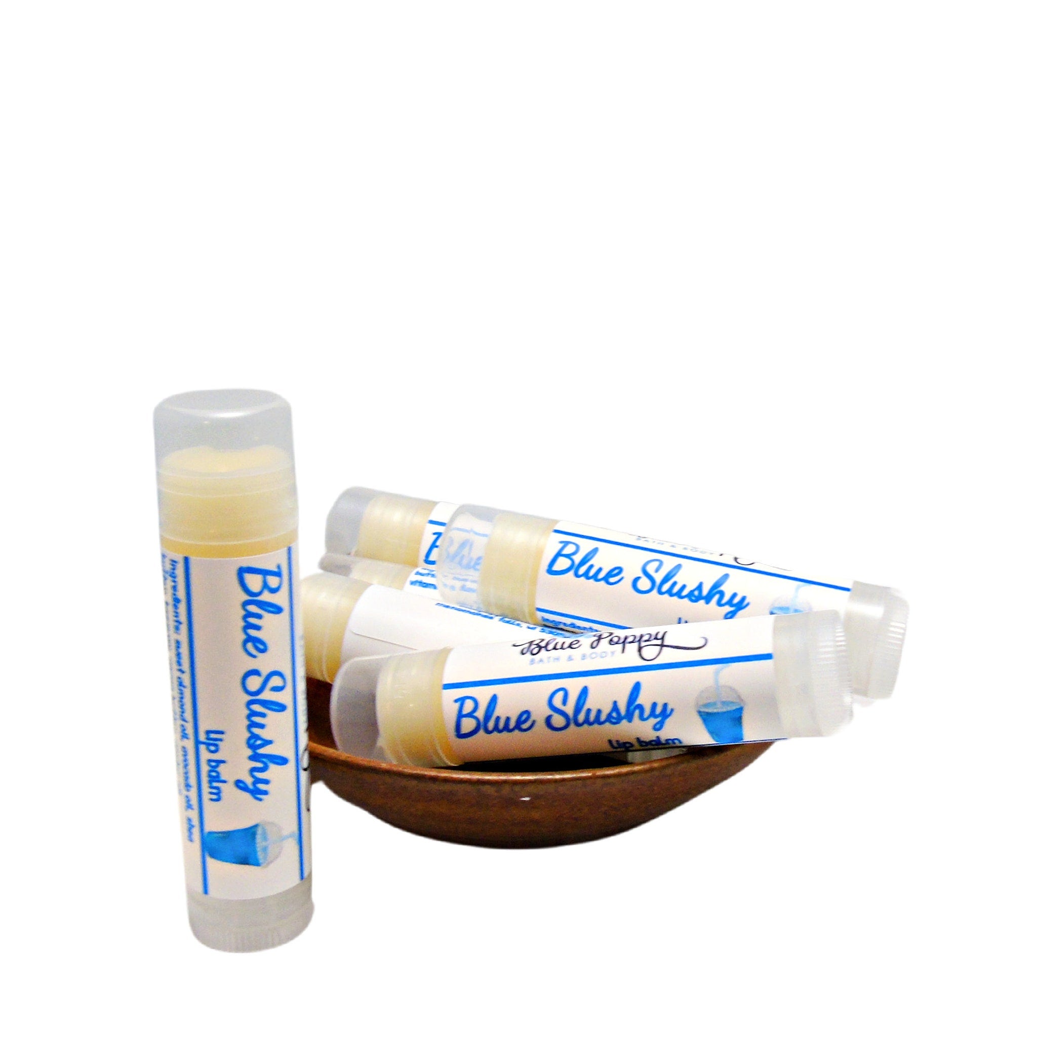 Lip balm tubes with white and blue labels, clear caps, and yellow balm inside, Blue Slushy brand