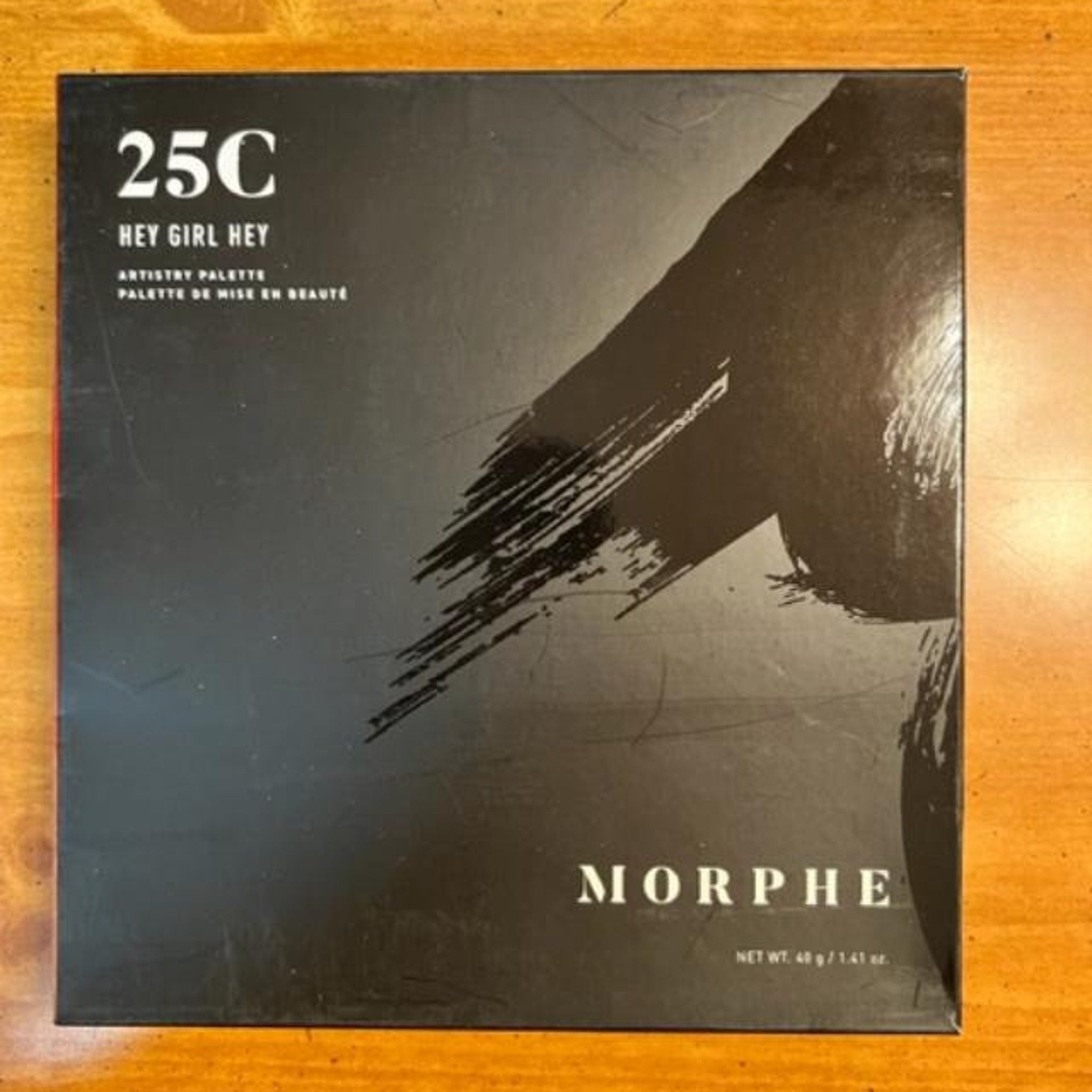 Front view of Morphe Artistry Palette 25C with 25 vibrant eye shadow shades in warm neutrals and bold hues, sleek black case
