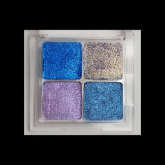 Open duochrome eyeshadow palette displaying eight shimmering shades in metallic and iridescent finishes