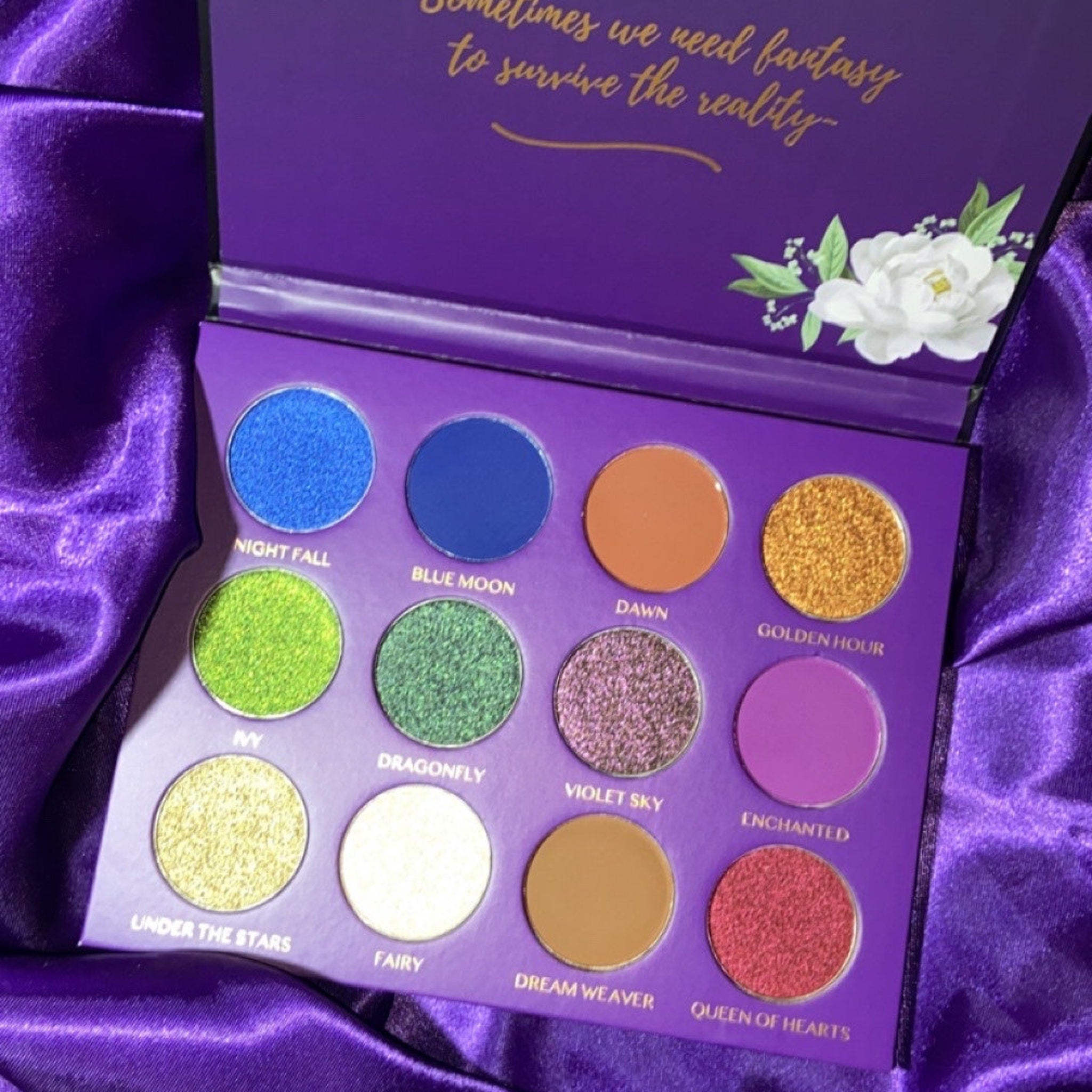Midnight Garden Eyeshadow Palette featuring 12 vibrant shades in matte and shimmer finishes, housed in sleek black packaging