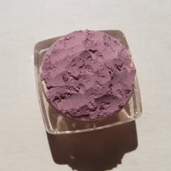 Close-up of matte light purple loose mineral eye shadow with soft powdery texture in Persian Lily shade