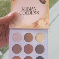 Close-up of Nubian Goddess Eyeshadow Palette showing rich matte and shimmer shades in warm browns and golds