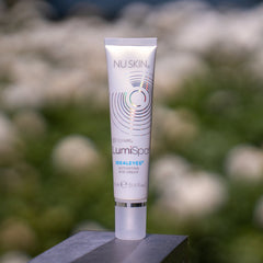 Eye makeup activating cream, white tube, silver cap, Nu Skin LumiSpa IdealEyes brand name visible