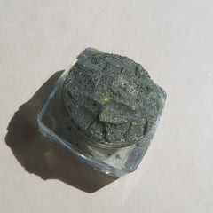 Glitter eyeshadow powder, dark gray, sparkly, in clear square container