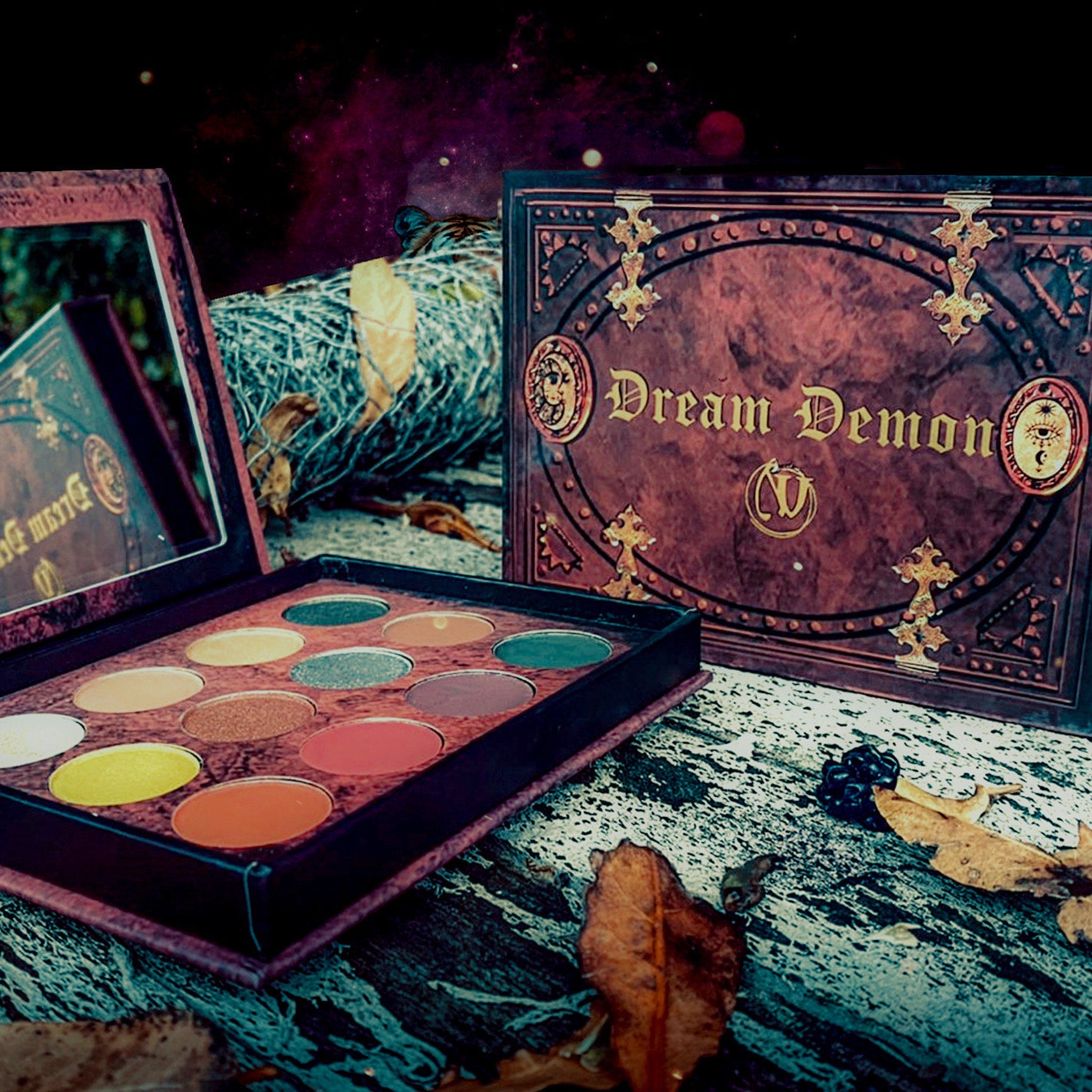 Side view of Dream Demon Eyeshadow Palette showcasing 12 vibrant matte and shimmer shades in sleek black compact