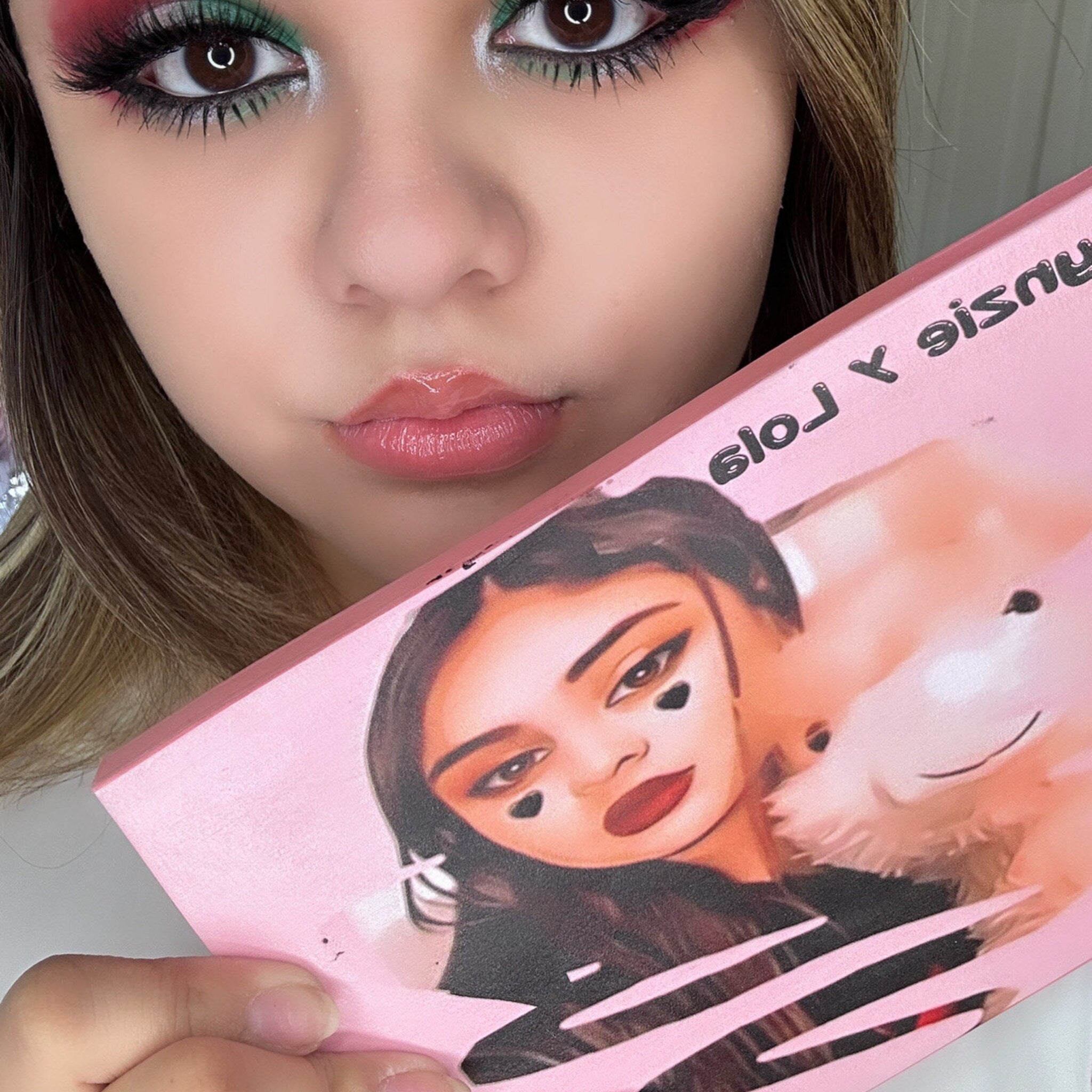 Side view of Lynzie & Lola eyeshadow palette showing rectangular compact with gradient sunset-colored shadows