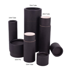 Cardboard tubes in black with various sizes and shapes, some with white interiors