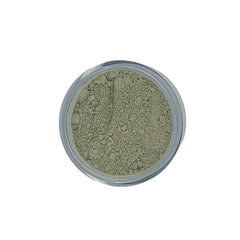 Powdered clay in a clear jar, light green color, grainy texture, top view