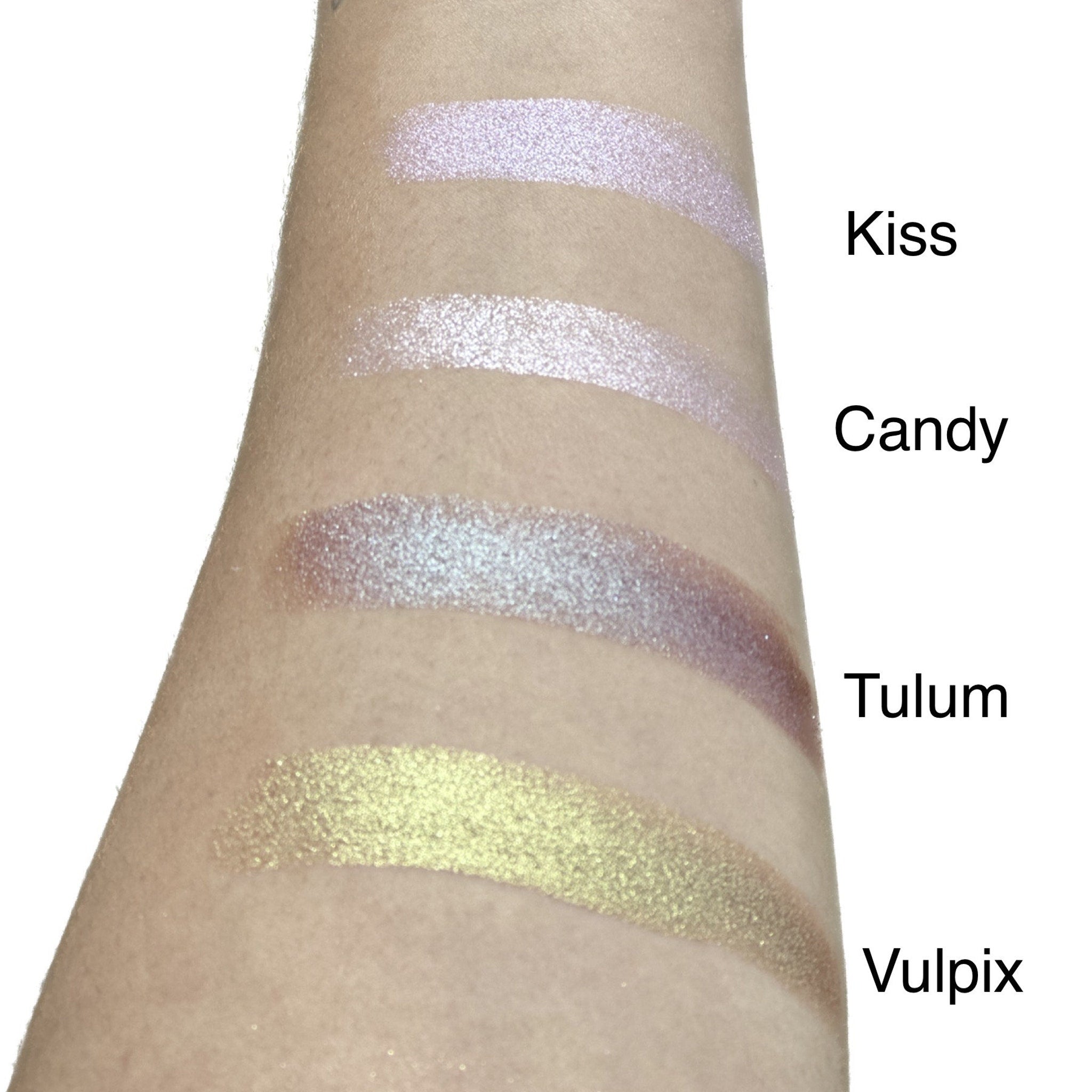 Swatch of duo chrome eyeshadow shifting from bronze to green on light skin tone