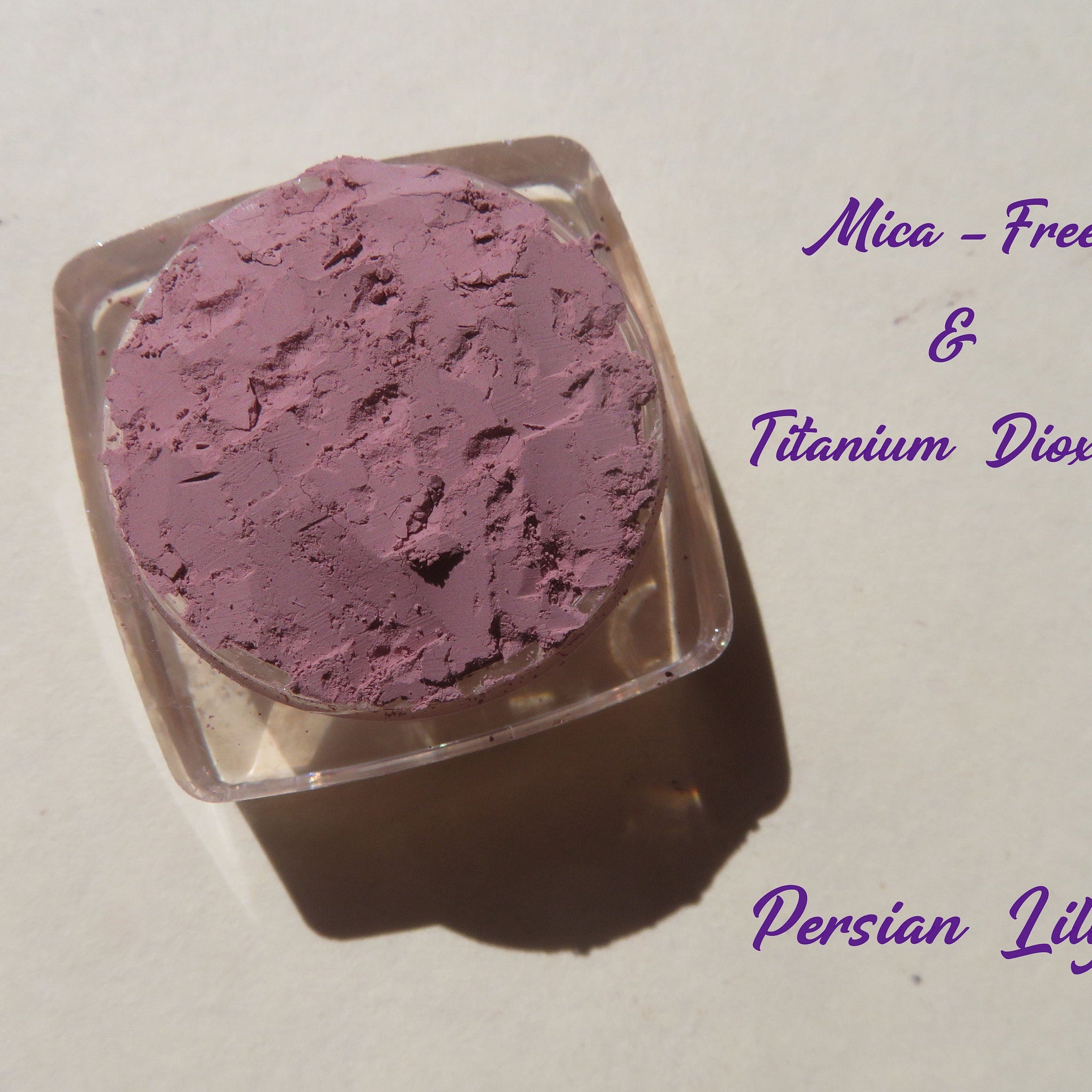 Side view of matte light purple loose mineral eye shadow pigment in Persian Lily shade, cruelty-free and vegan.