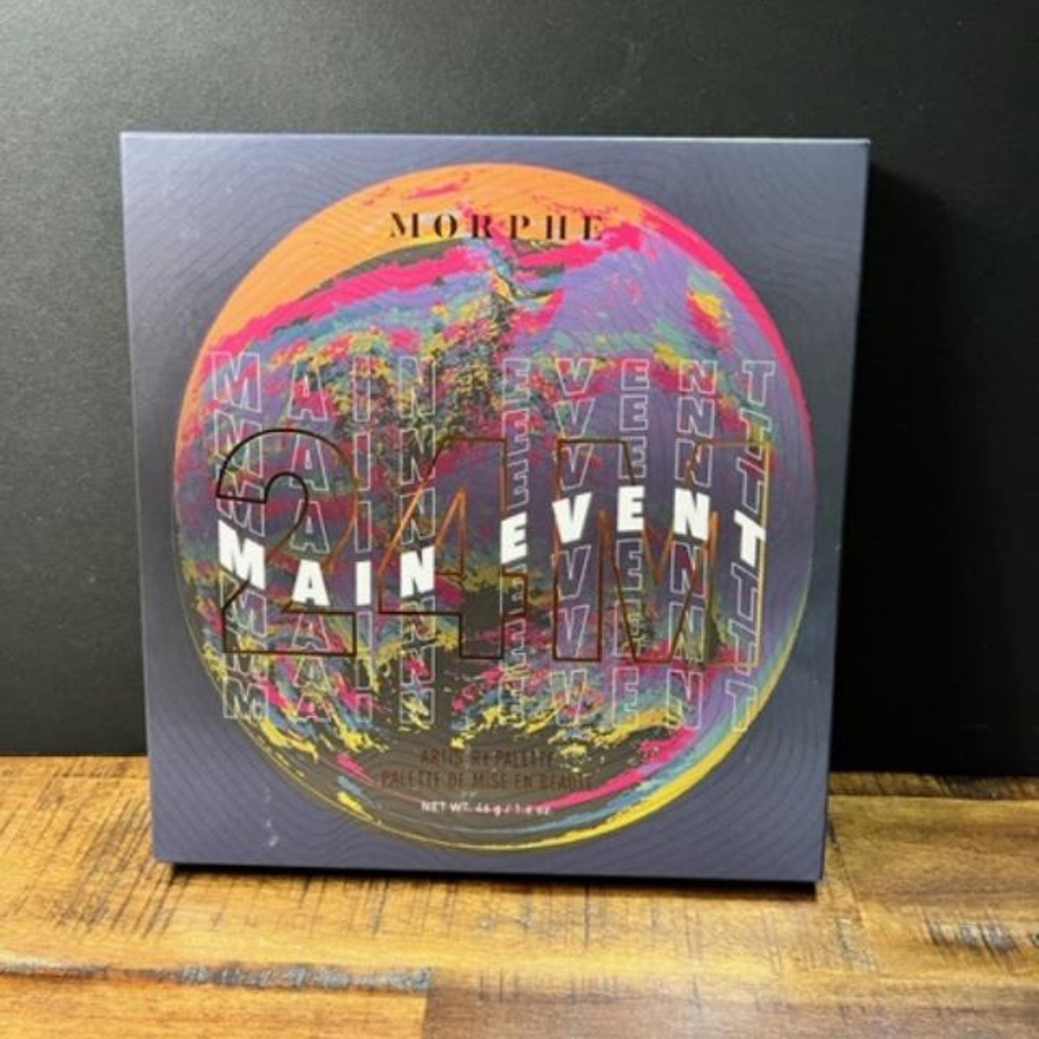 Eyeshadow palette with Morphe logo, colorful abstract design, and text overlay on a dark background