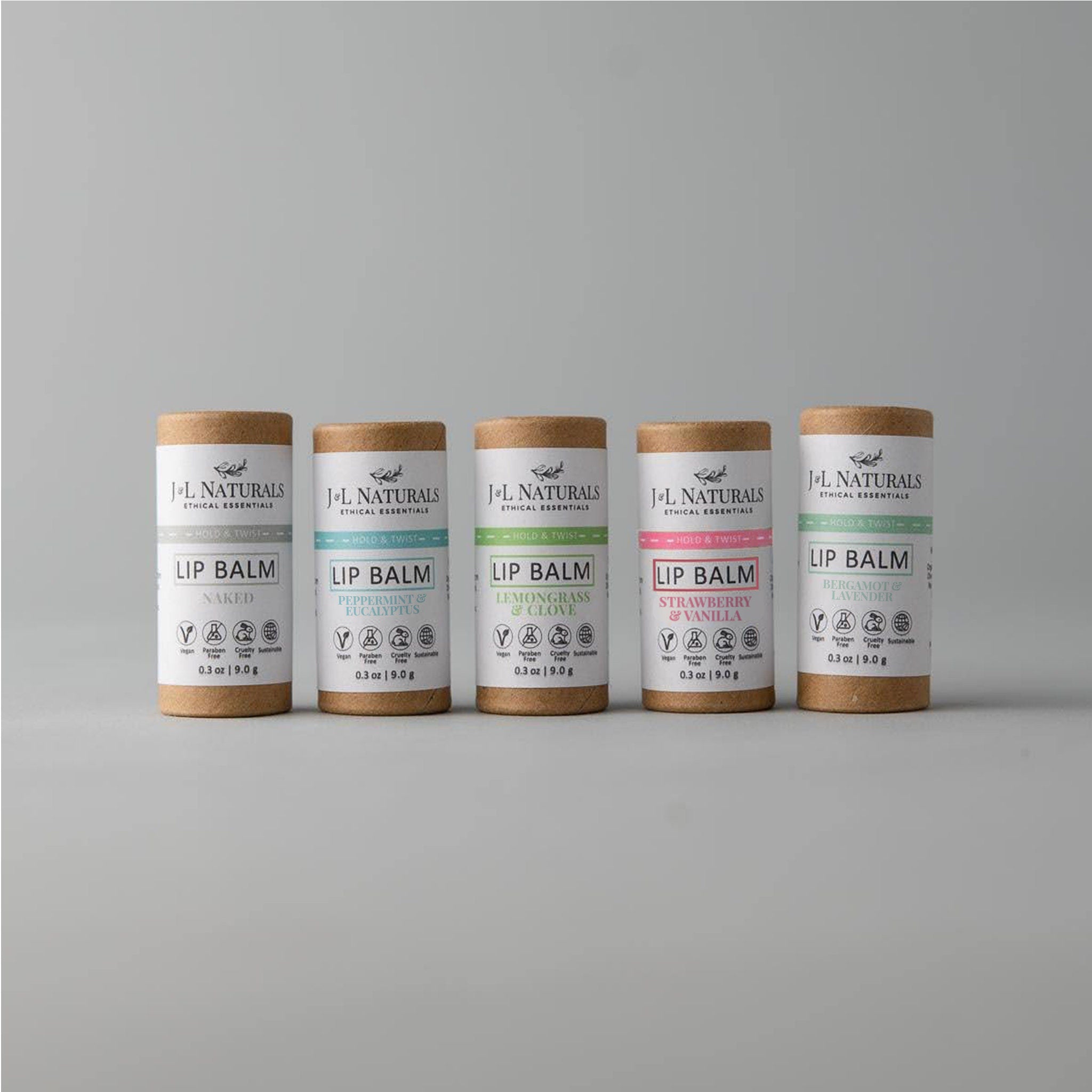Lip balm tubes in brown and white with J&L Naturals branding, various flavors shown, for lip care