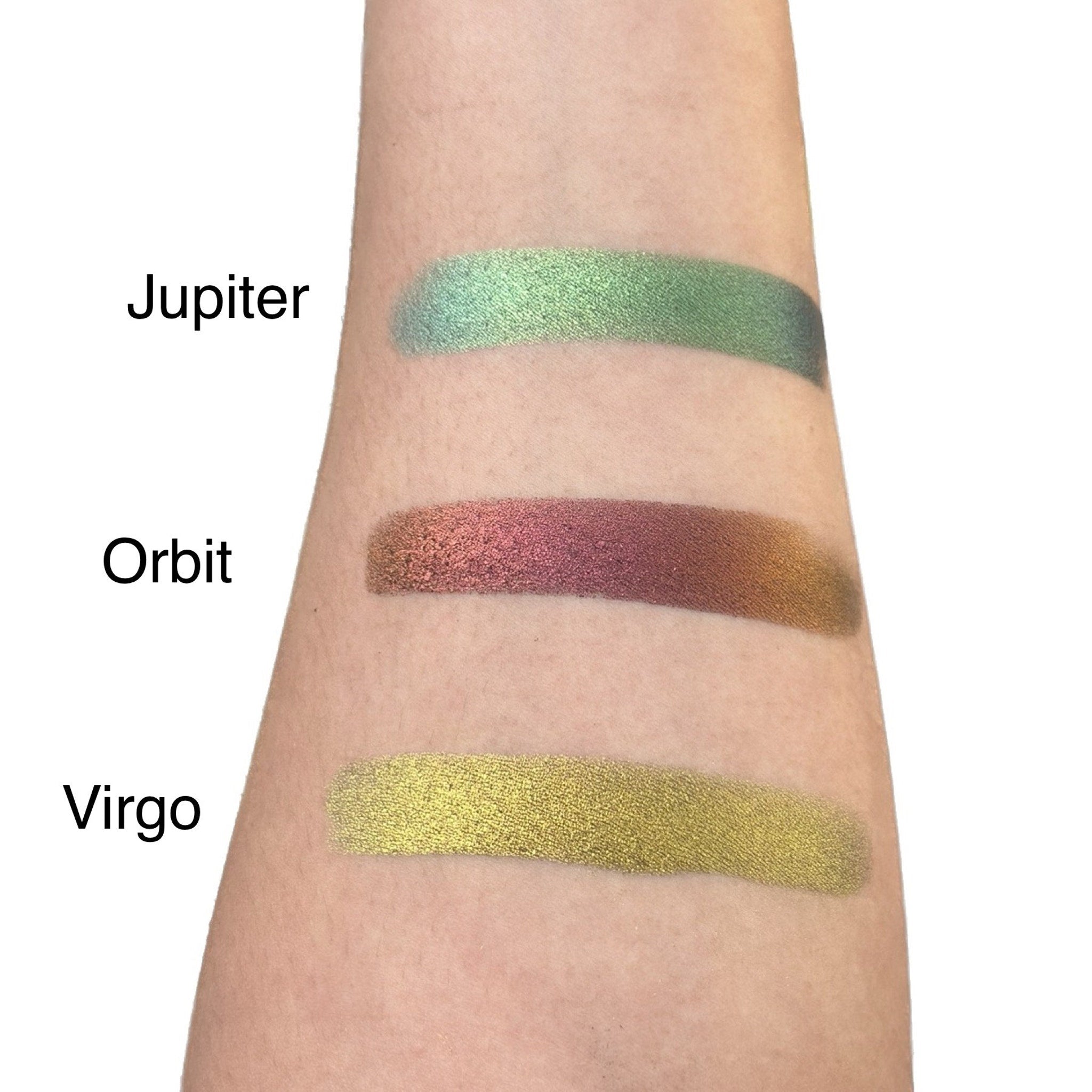 Close-up of duo chrome eye shadow palette showing shimmering metallic shades in compact case