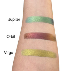 Close-up of duo chrome eye shadow palette showing shimmering metallic shades in compact case