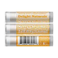 Lip balm tubes with orange and white label, Delight Naturals brand, Merry Christmas text