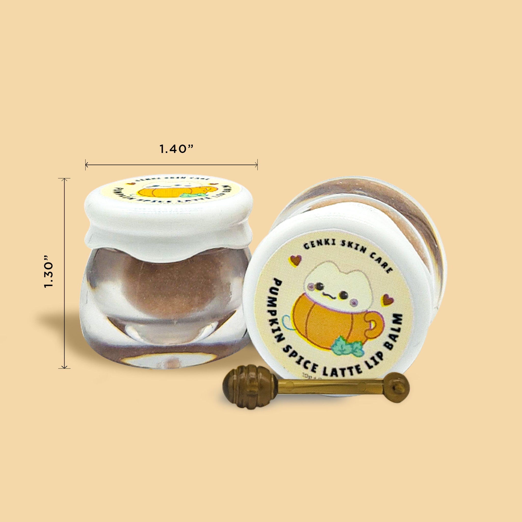 Lip balm jars with white lids, clear glass, and Genki Skin Care label with pumpkin design