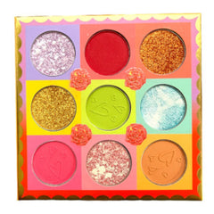 Side view of KEVIN & COCO 9-shade eyeshadow palette showing rectangular pans with matte and shimmer textures in warm neutral tones