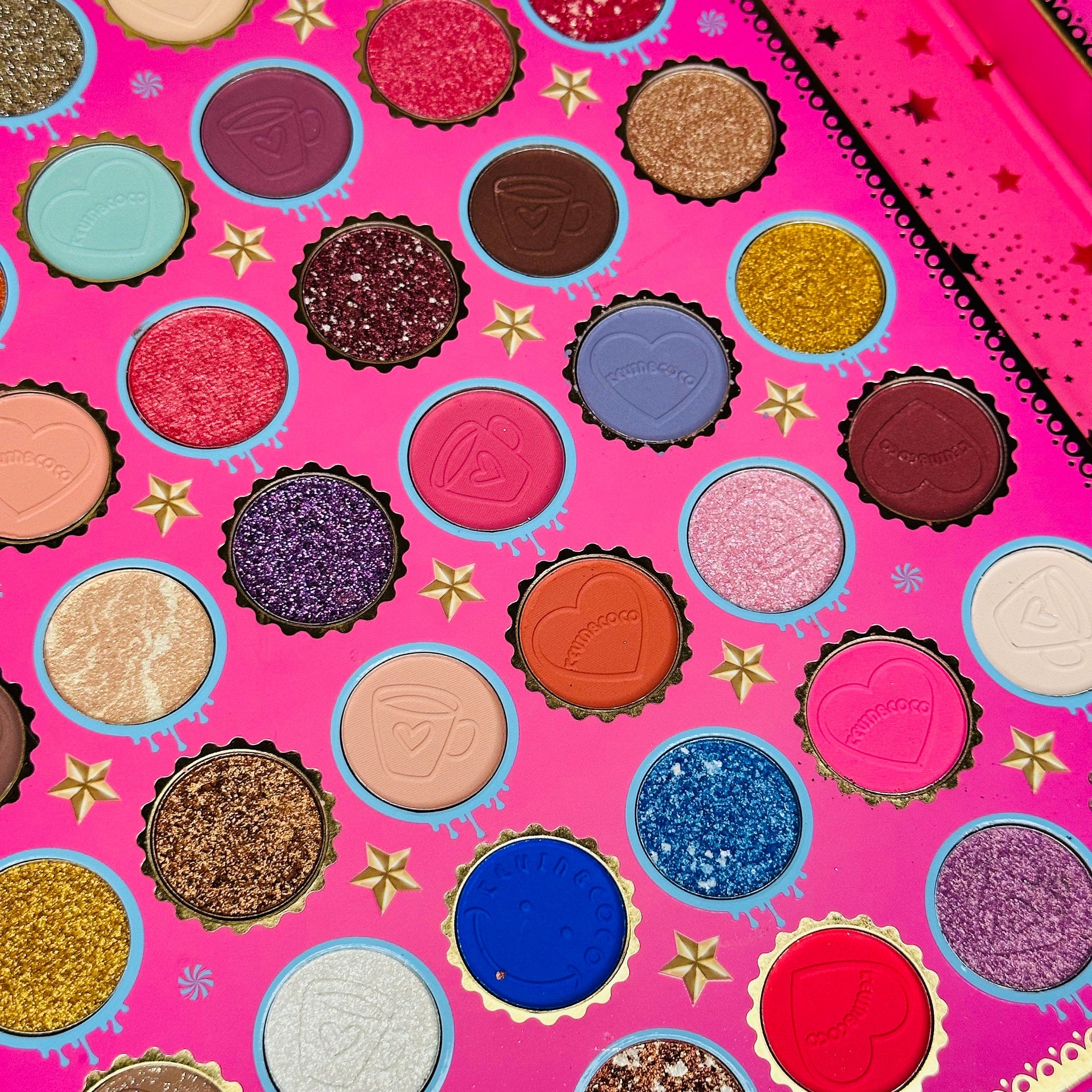 Eye shadow palette with pink, gold, and glitter colors, Kevin and Coco brand