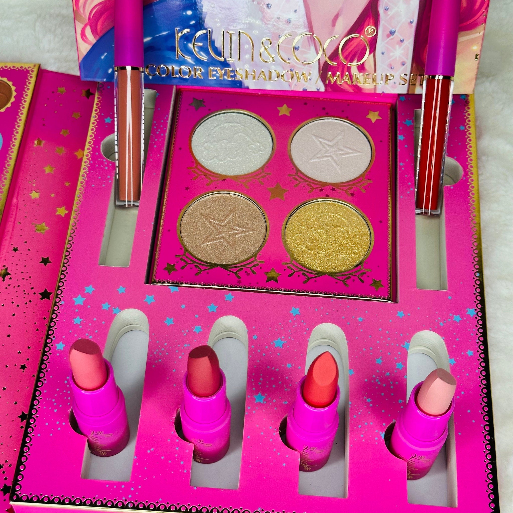 Open pink eyeshadow palette with six shimmer shades displayed on a white background