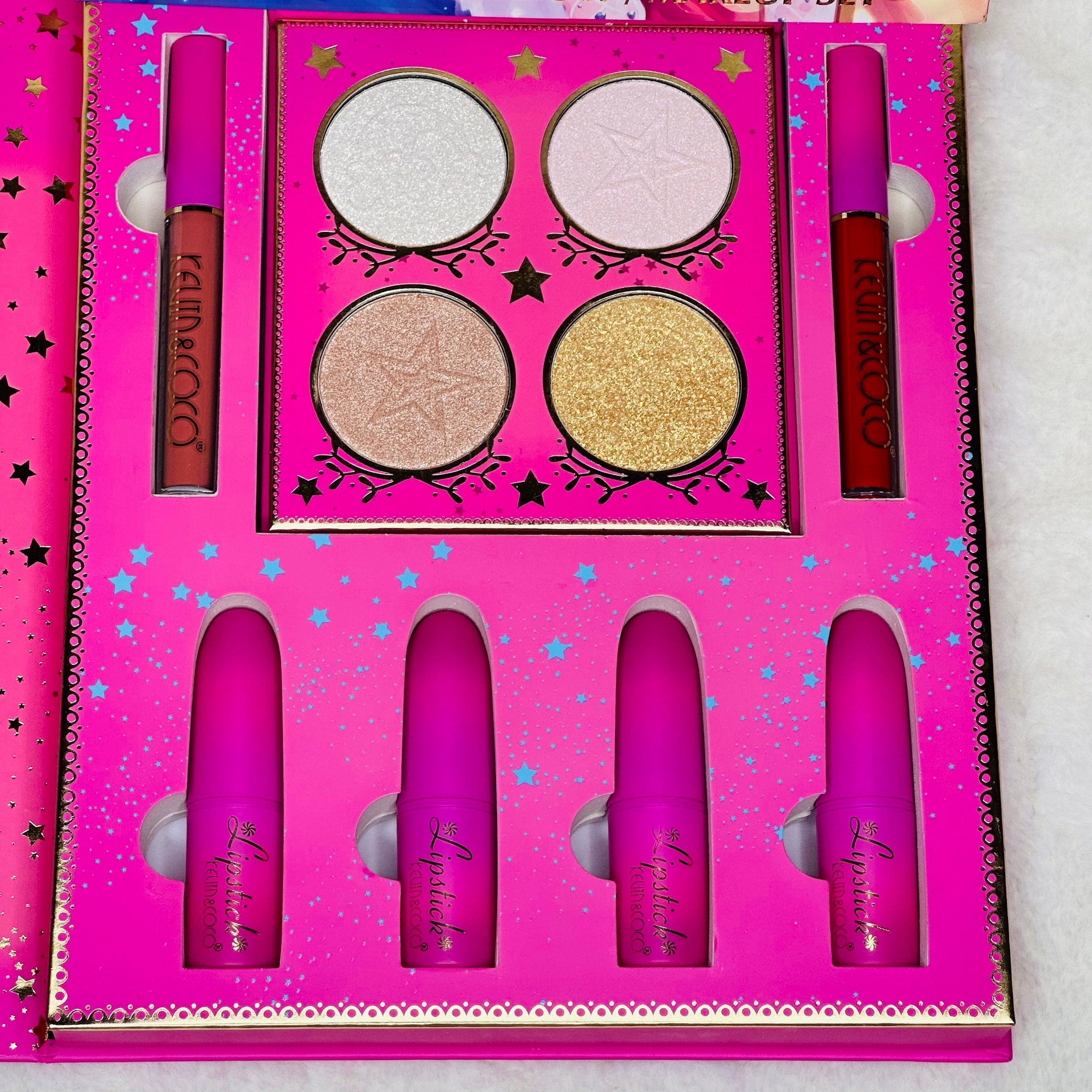 Side view of pink eyeshadow palette showing gradient shades from soft blush to deep rose in rectangular compact