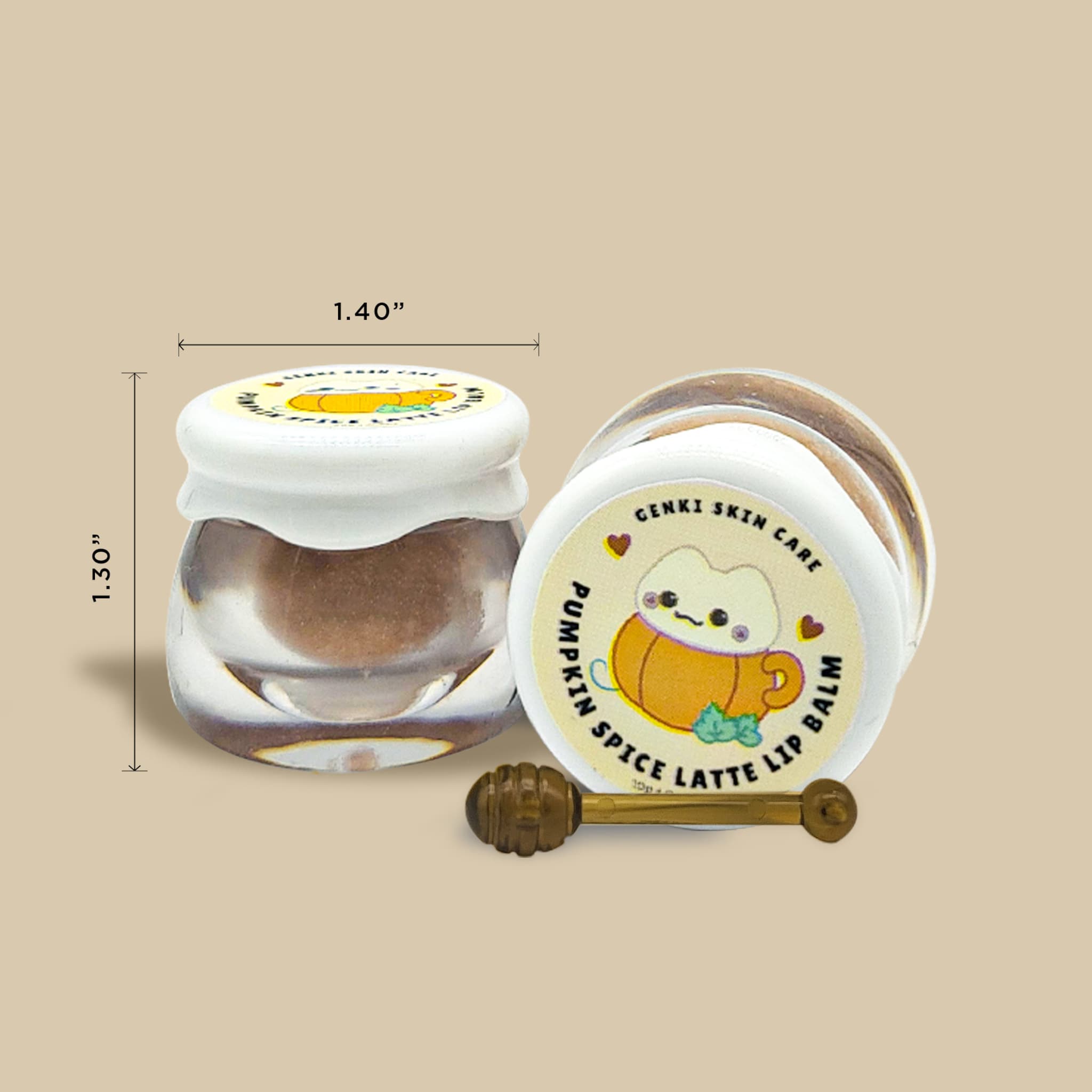 Lip balm jars with white lids, clear glass, and Genki Skin Care label with pumpkin design