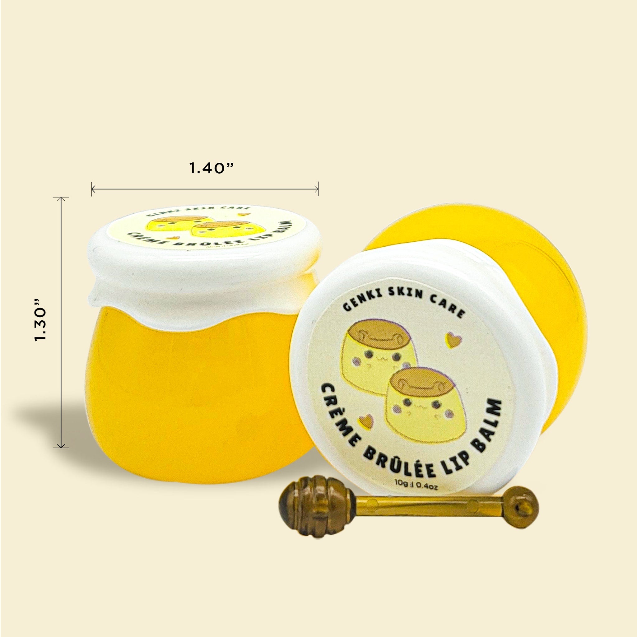 Lip balm jars in yellow and white with Genki Skin Care branding and a small gold applicator