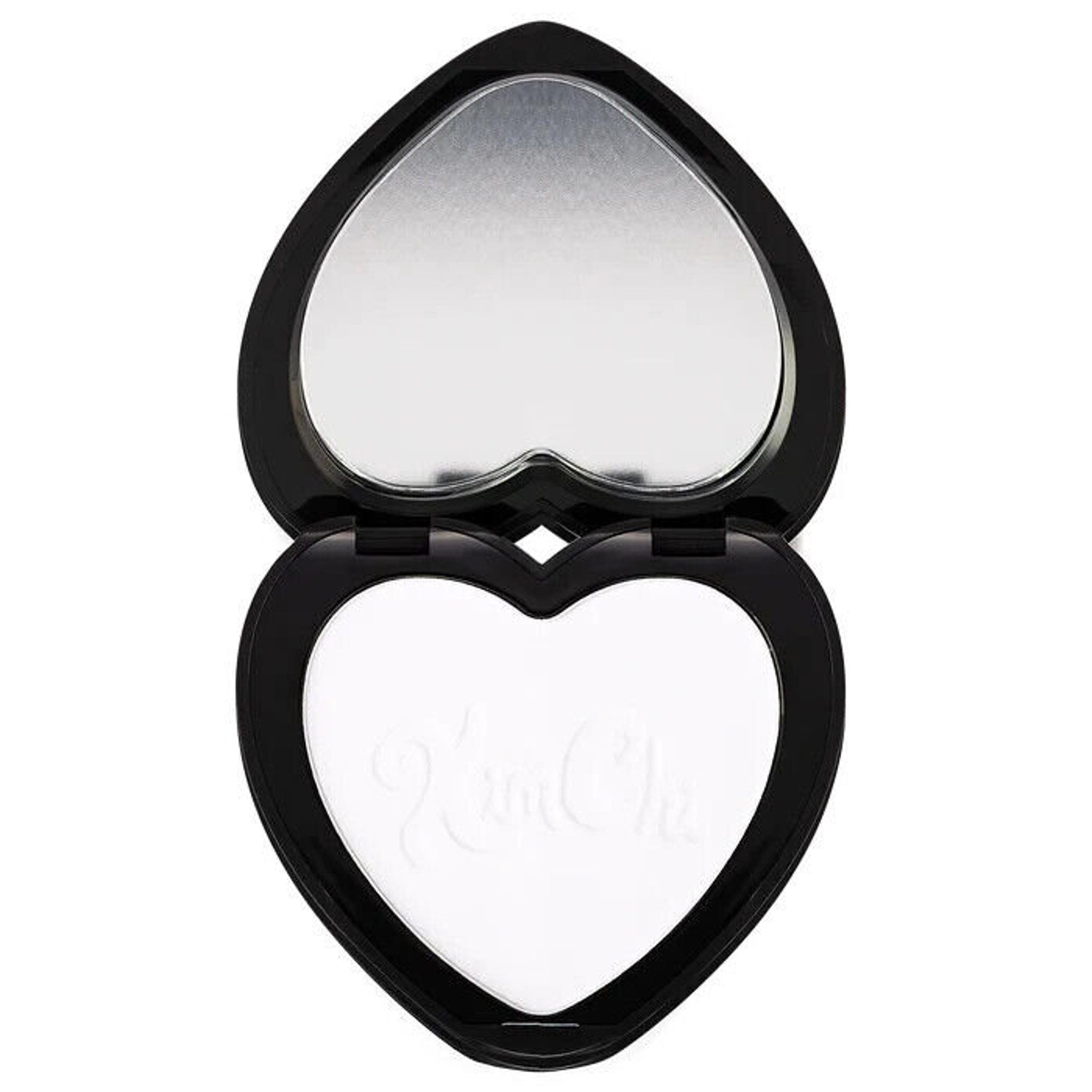 Heart-shaped compact with black frame, mirror, and white powder with Kim Chi text