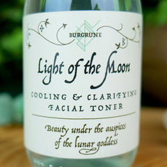 Facial toner bottle with white label, black text, and BURGRUNE brand name visible