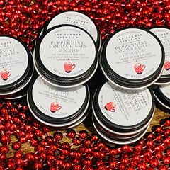 Lip butter tins with black lids, white labels, and red polka dot mug illustration, by Ink Flower Scent Co