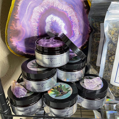 Sugar scrub jars with black lids, silver labels, and purple scrub, GIOU Berry brand visible