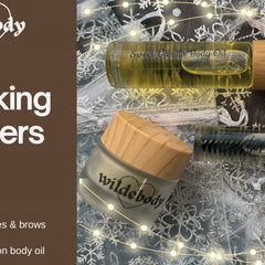 Body oil bottle with Sweet Vanilla text, wooden cap, and clear glass with product name visible