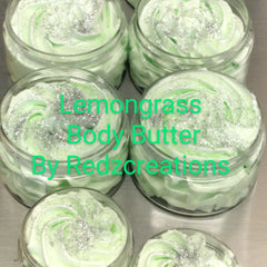 Close-up of whipped shea butter moisturizer in a white jar with creamy texture and natural ingredients visible