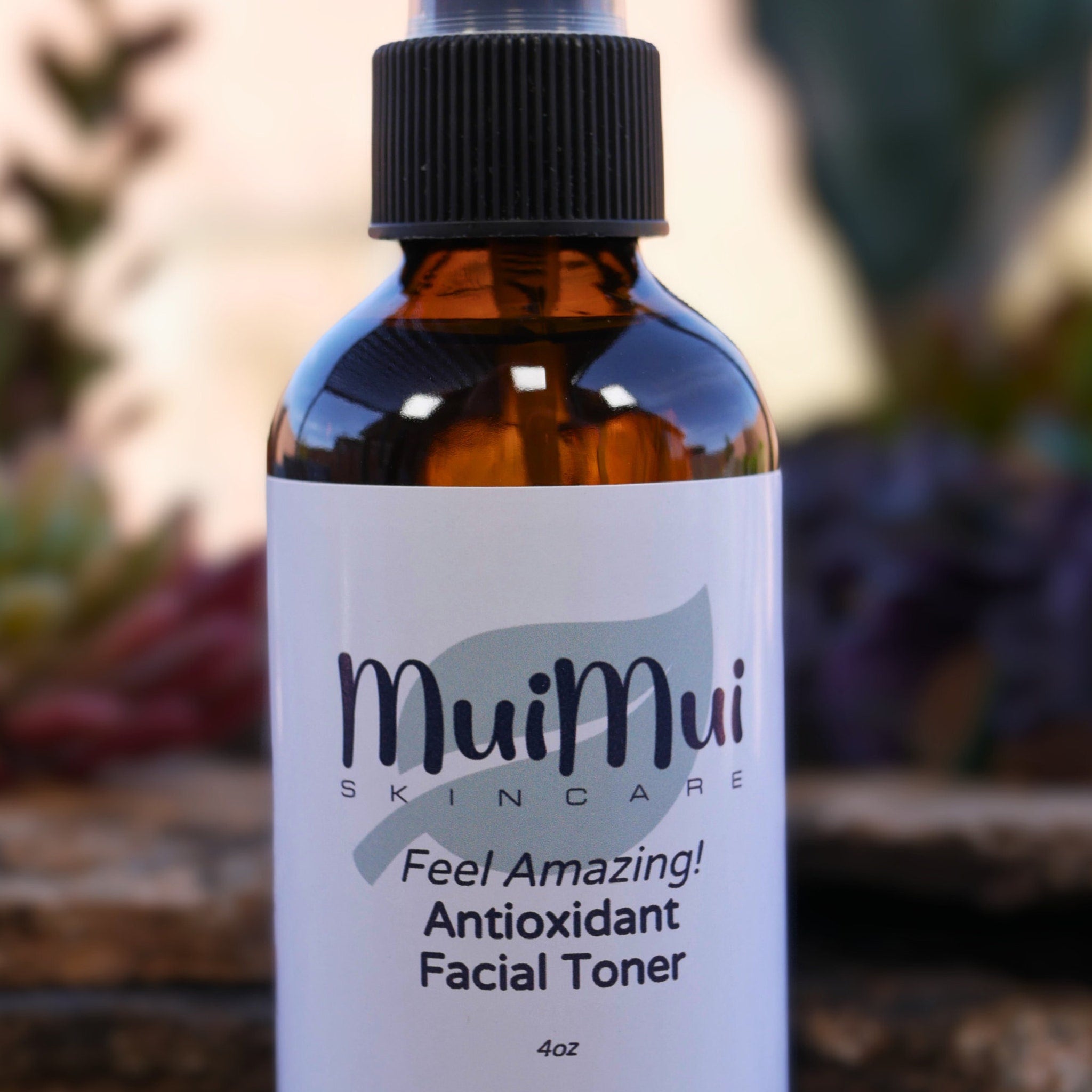 Facial toner bottle with brown glass, black cap, and white label with MuiMui text