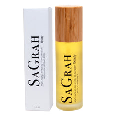 Facial cleanser bottle with yellow liquid, wooden cap, and white box with brand name SAGRAH