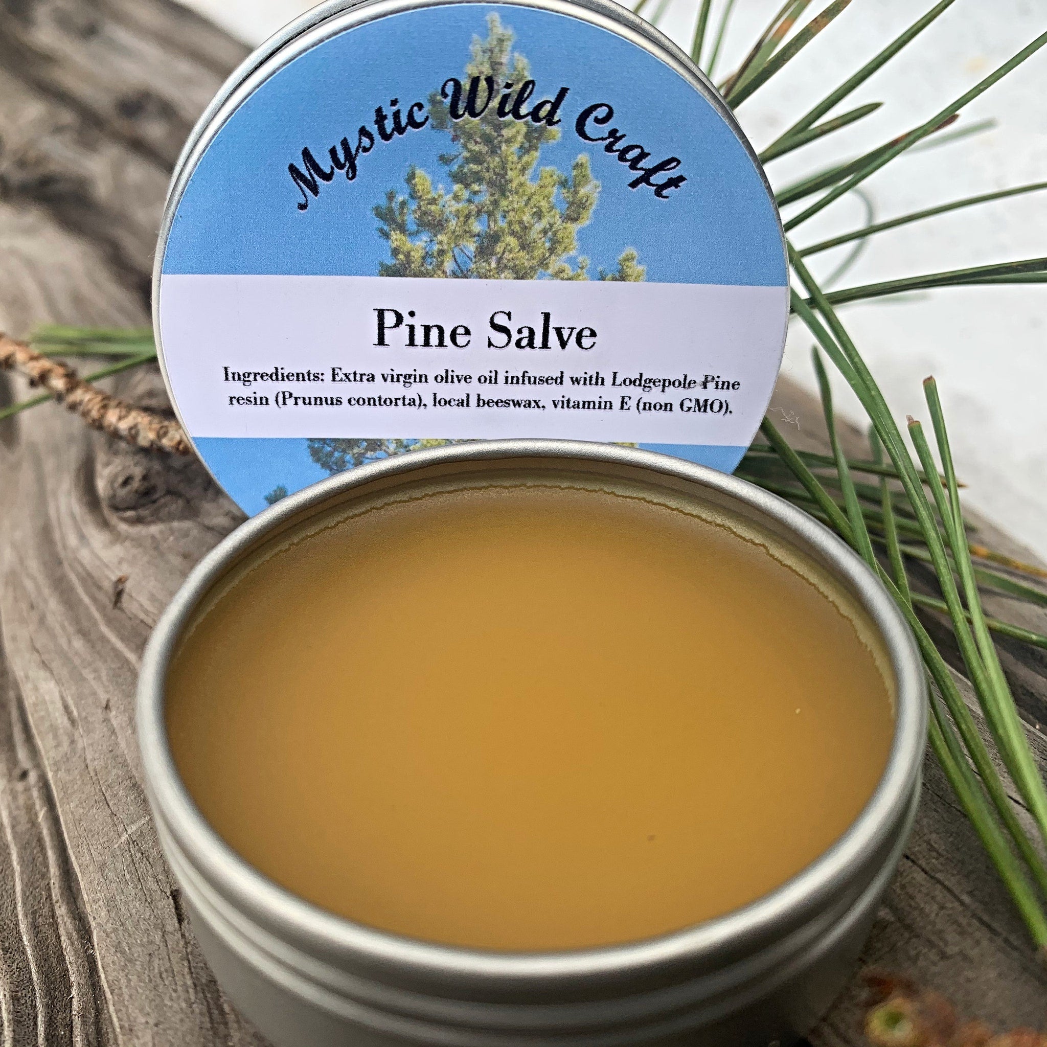 Rustic tin of Canadian Pine Salve with natural wood lid and minimalist label, showcasing wildcrafted skincare