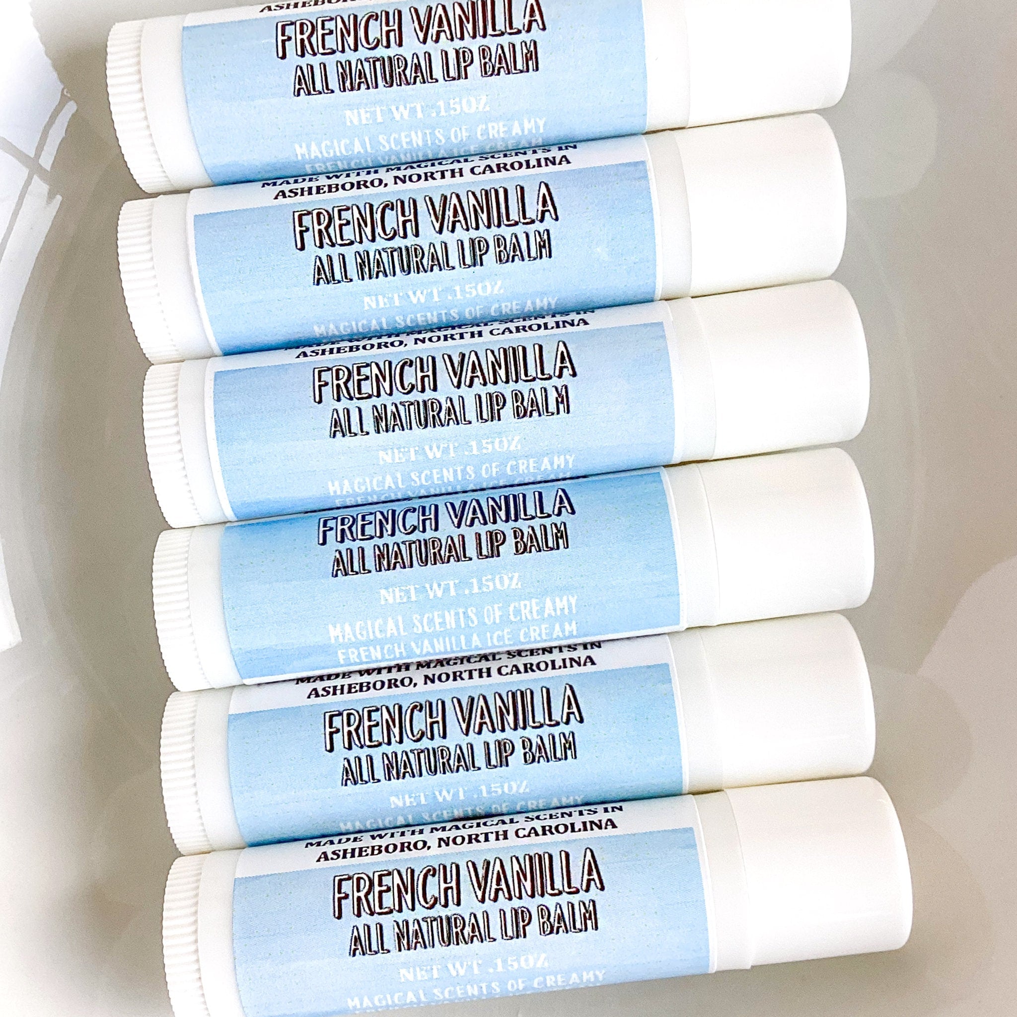 Lip balms with white tubes and blue labels, Salted Mule French Vanilla flavor