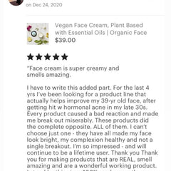 Hand applying vegan face cream with fingertips, showing lightweight texture blending into skin