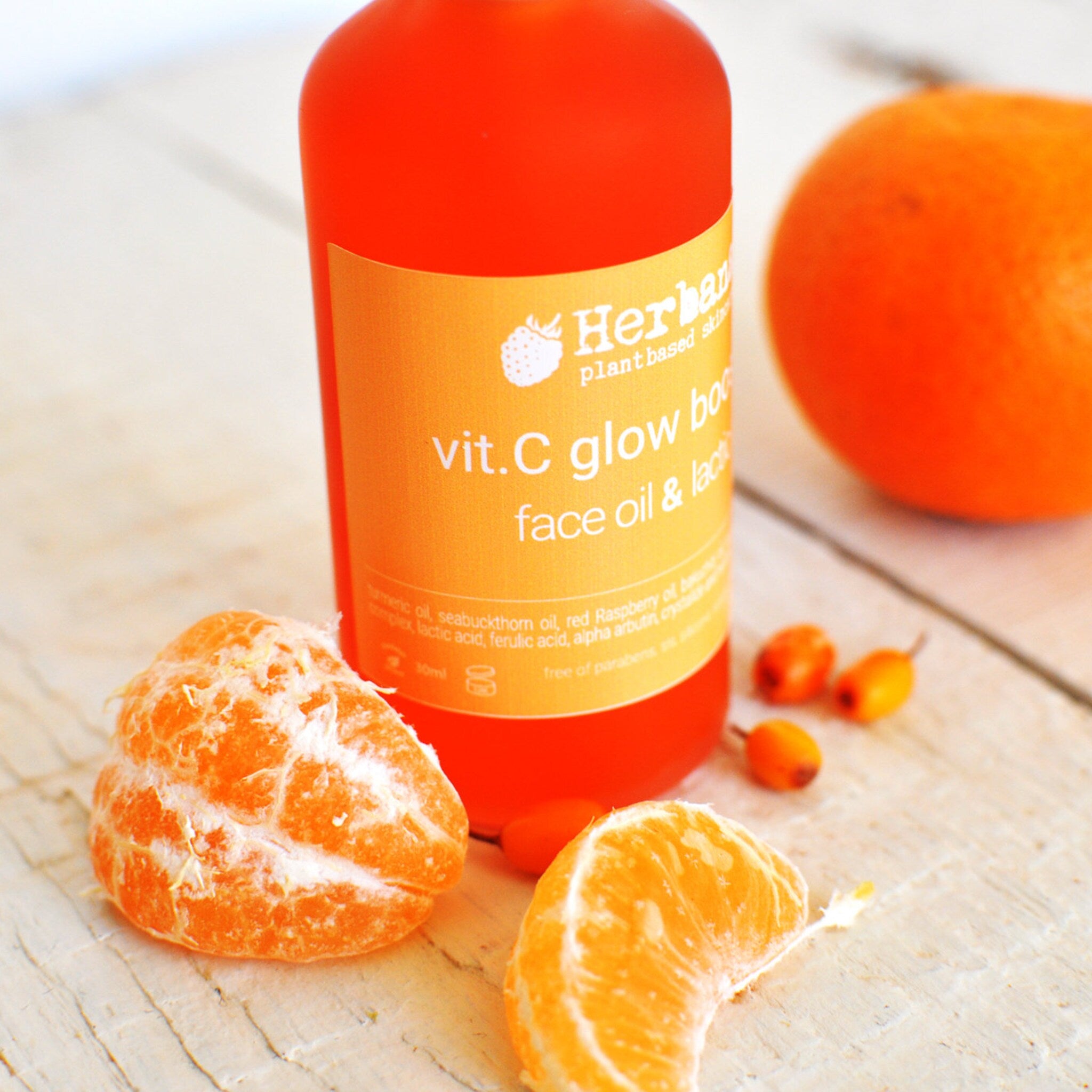 Side view of amber glass serum bottle with dropper, showcasing minimalist label and golden vitamin C liquid