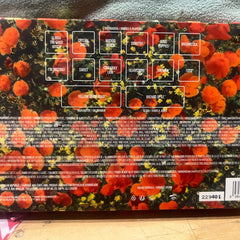 Eyeshadow palette with orange and yellow floral pattern, and text labels.