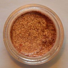 Side view of Noisette mineral eyeshadow compact showing matte taupe powder and sleek black case design
