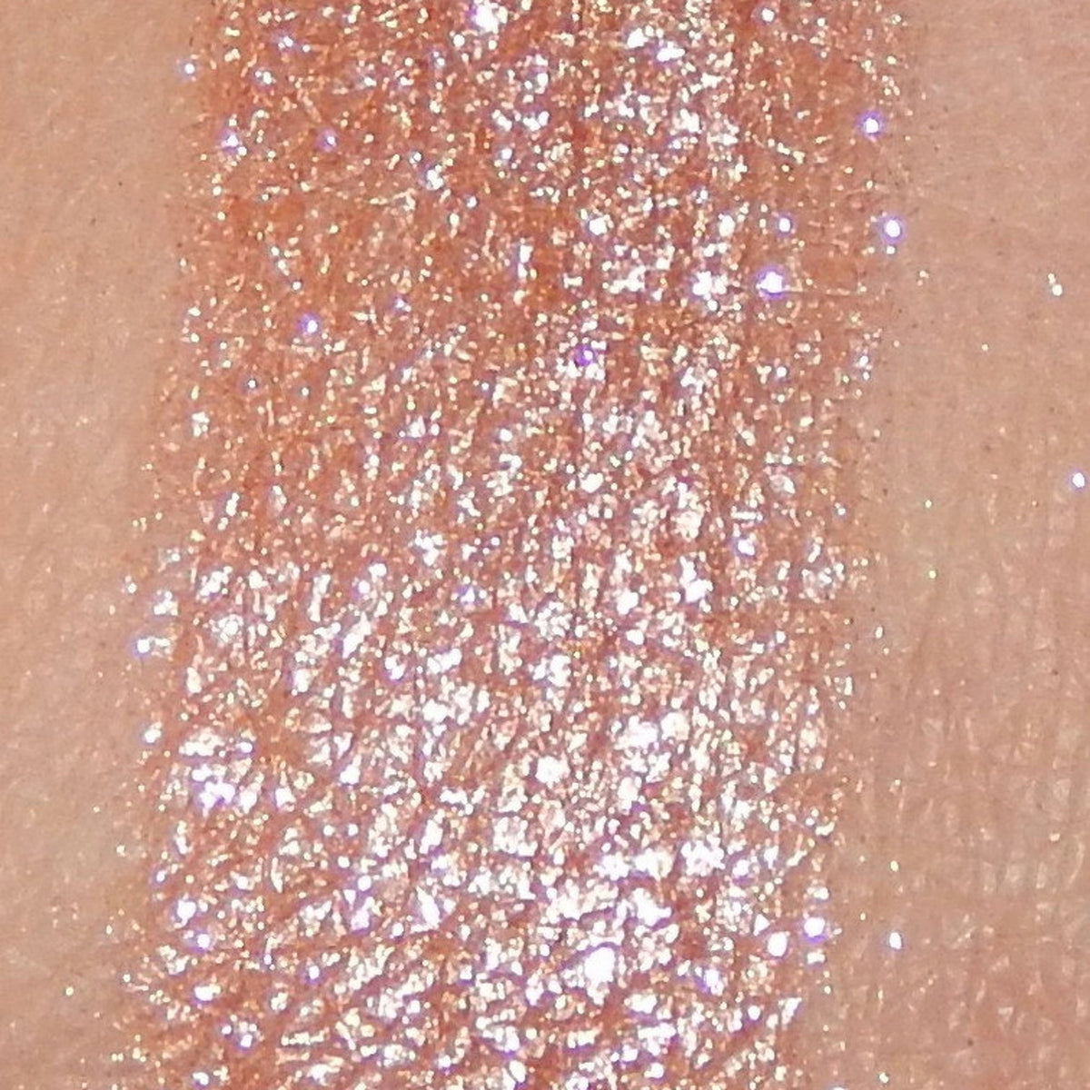 Close-up of Noisette mineral eye shadow in round compact with soft matte finish and warm taupe hue