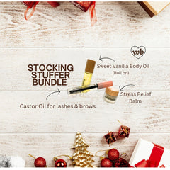 Body balm set with wooden lids, clear bottles, and Wildebody logo on white wood background